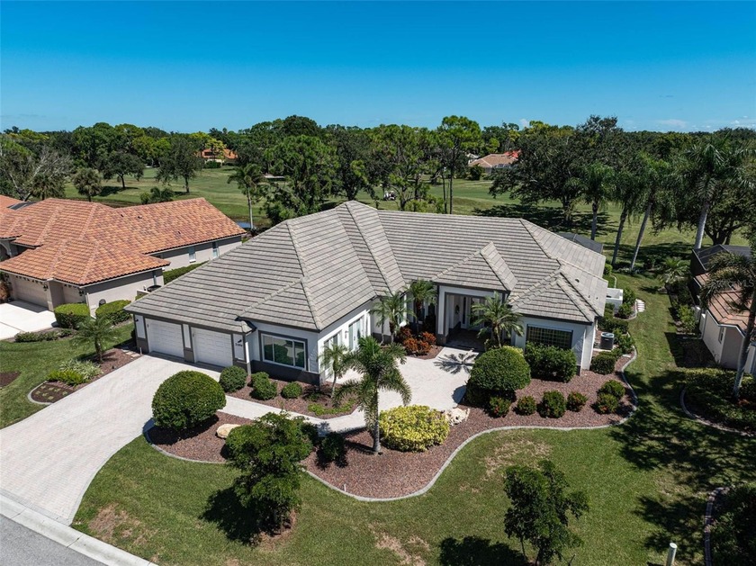 Discover refined living in this expansive Calusa Lakes estate - Beach Home for sale in Nokomis, Florida on Beachhouse.com