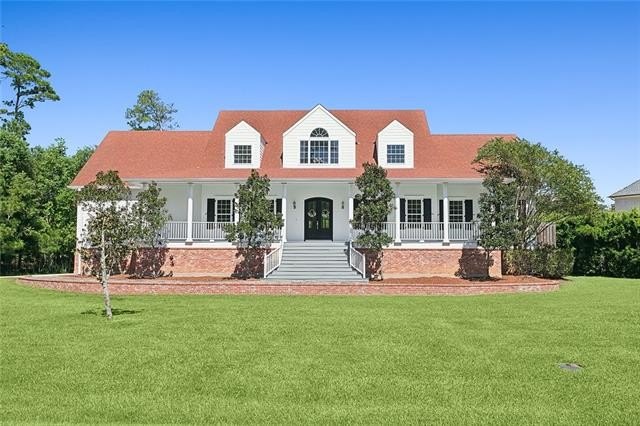 Don't miss this beautiful raised Acadian-style home offered for - Beach Home for sale in Mandeville, Louisiana on Beachhouse.com