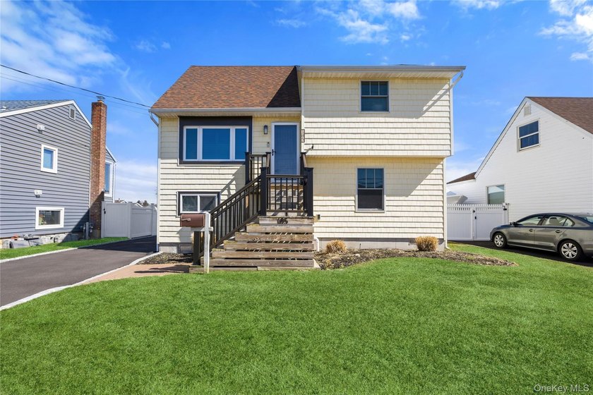 Welcome to to this Beautiful Raised Split Level Home with 50 ft - Beach Home for sale in Copiague, New York on Beachhouse.com