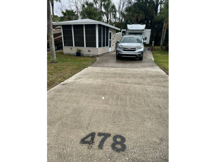 This shaded RV site includes a 20'x20' suite with full - Beach Lot for sale in Titusville, Florida on Beachhouse.com