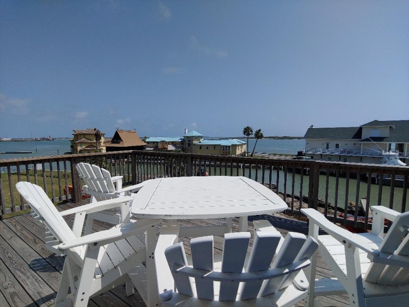 Sip your beverage on the deck watching ships pass - Beach Vacation Rentals in Port Aransas, Texas on Beachhouse.com
