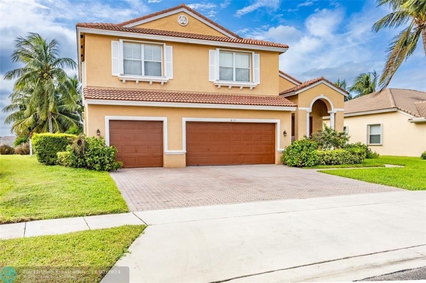 Welcome to this stunning residence with 5 bedrooms plus a den,3 - Beach Home for sale in Lake Worth, Florida on Beachhouse.com