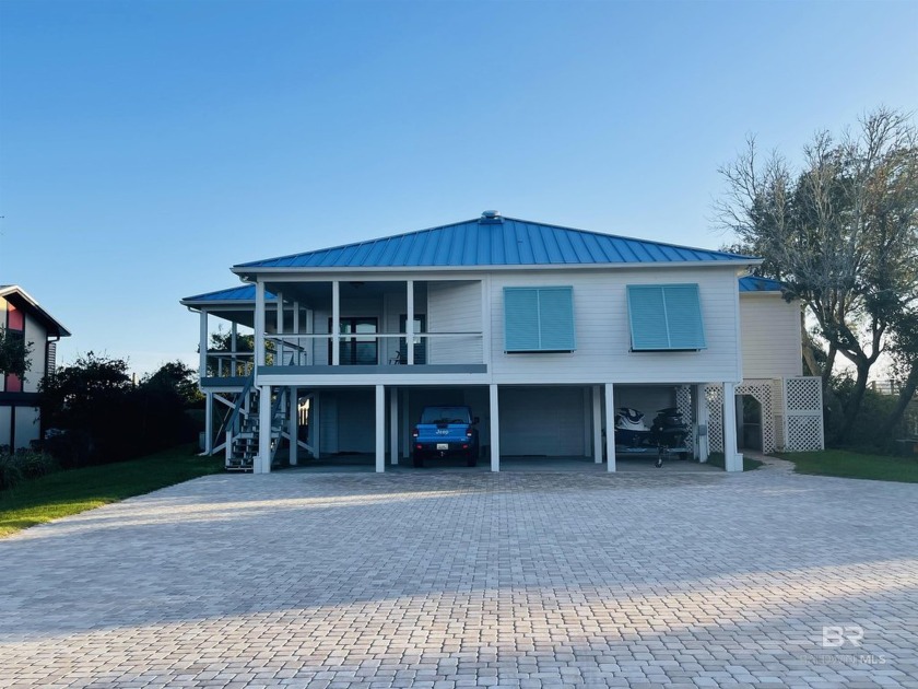 BOATERS PARADISE! This 4 bedroom, 3 bathroom home has open floor - Beach Home for sale in Orange Beach, Alabama on Beachhouse.com