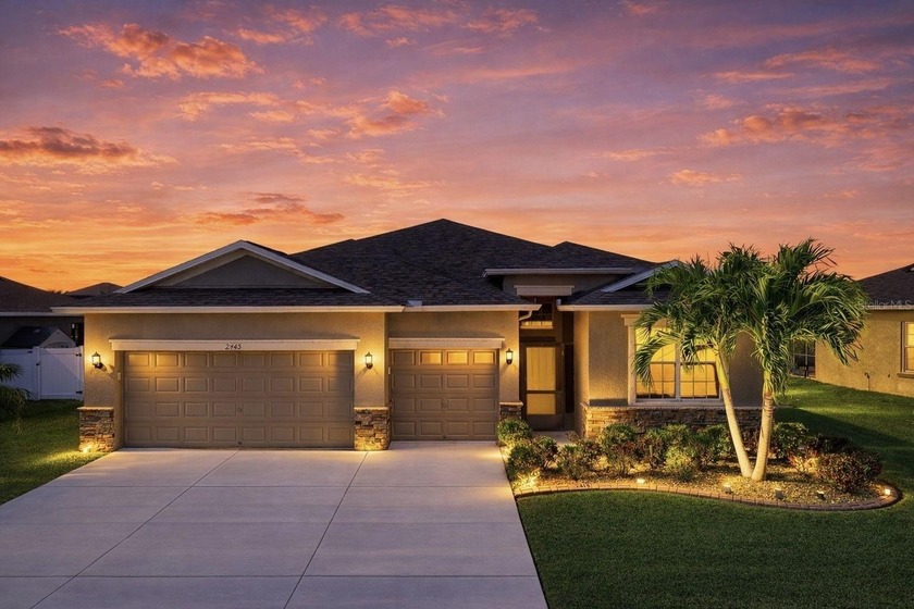 Situated on a beautifully manicured lot with a serene pond view - Beach Home for sale in Ruskin, Florida on Beachhouse.com