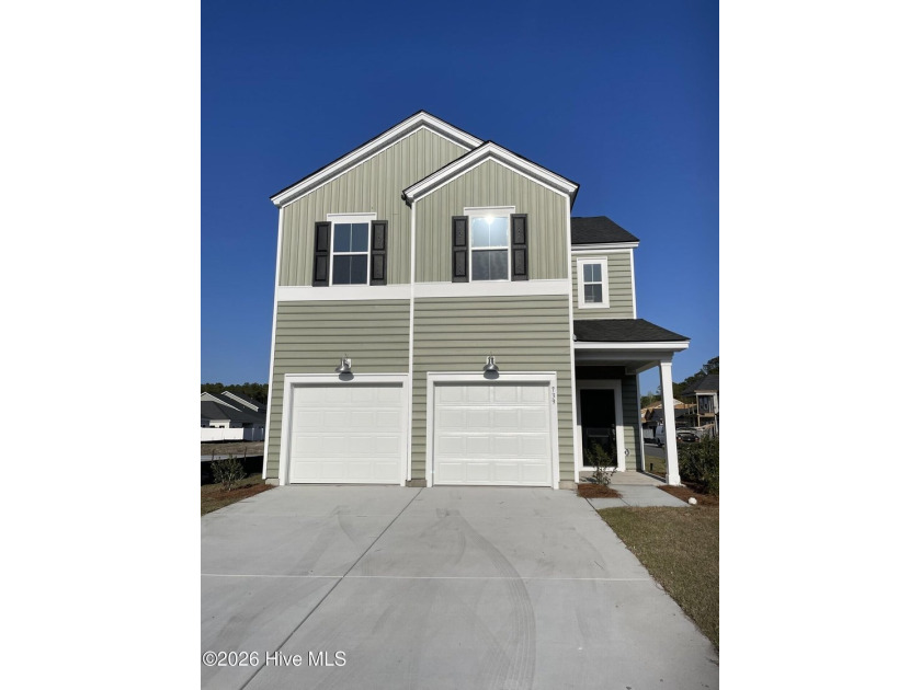 This two-story home features a family room and modern kitchen - Beach Home for sale in Ocean Isle Beach, North Carolina on Beachhouse.com