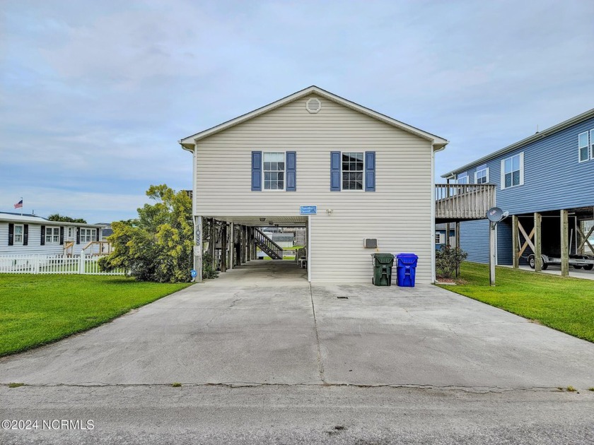 Welcome to 1038 1st St, a charming canal front home located in - Beach Home for sale in Surf City, North Carolina on Beachhouse.com