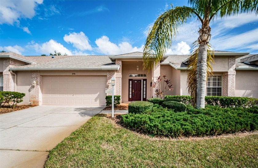 This meticulously maintained 2-bedroom, 2-bath villa offers a - Beach Home for sale in Trinity, Florida on Beachhouse.com