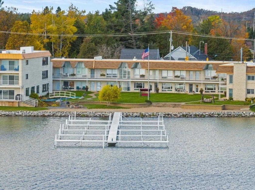 Set along the western shore of Crooked Lake, this beautifully - Beach Condo for sale in Conway, Michigan on Beachhouse.com