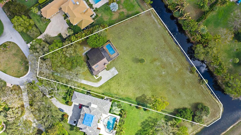 Set on a prime 1.6-acre homesite along one of the most desirable - Beach Home for sale in Palm Beach Gardens, Florida on Beachhouse.com