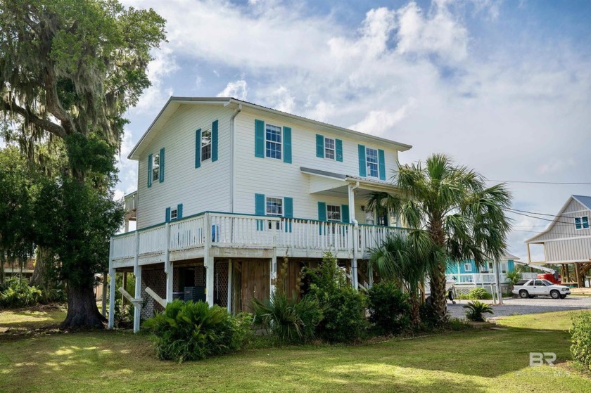 Discover the Charm of this Coastal Retreat! Experience the - Beach Home for sale in Gulf Shores, Alabama on Beachhouse.com