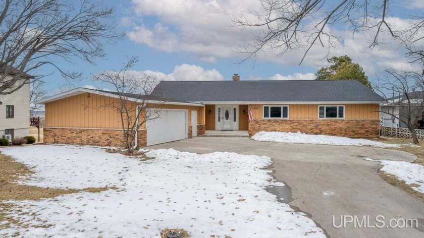 Welcome to this exceptional brick ranch home situated along the - Beach Home for sale in Escanaba, Michigan on Beachhouse.com
