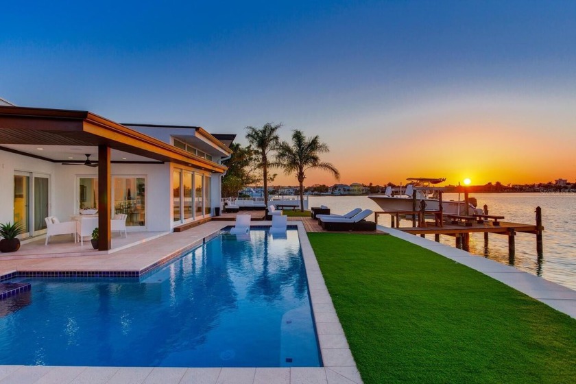 A MUST SEE STUNNING MODERN HOME ON POINT LOT WITH 100 FT OF OPEN - Beach Home for sale in Redington Beach, Florida on Beachhouse.com