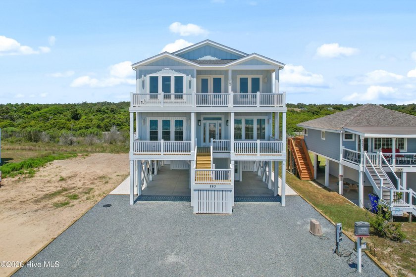 Just steps away from the sand, this beautifully designed coastal - Beach Home for sale in Holden Beach, North Carolina on Beachhouse.com