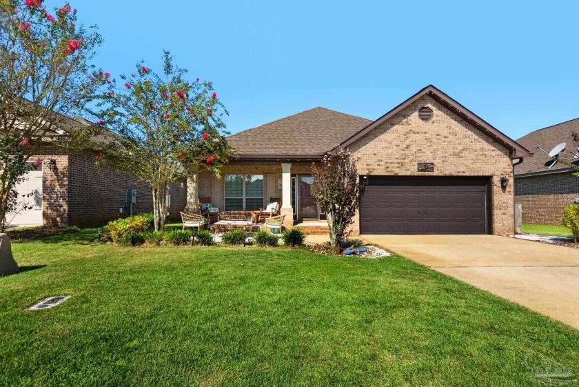 Welcome to this distinguished all-brick residence, a rare blend - Beach Home for sale in Pace, Florida on Beachhouse.com