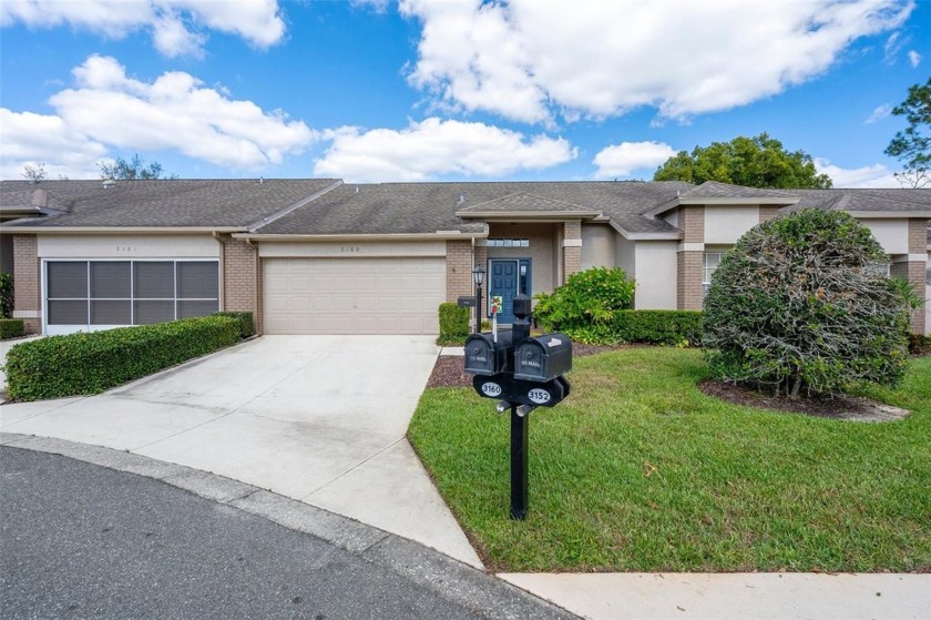 Welcome to this charming 2-bedroom, 2-bathroom villa nestled on - Beach Home for sale in Spring Hill, Florida on Beachhouse.com