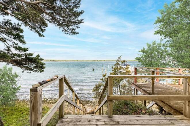 Nestled on the eastern shoreline of Three Mile Harbor lies this - Beach Home for sale in East Hampton, New York on Beachhouse.com