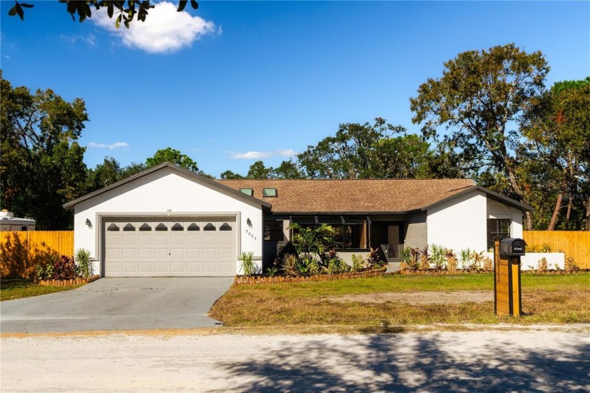 Live the Florida Dream in this Stunning Corner Lot Home on 1/3 - Beach Home for sale in Weeki Wachee, Florida on Beachhouse.com