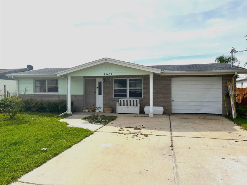 HANDYMAN WATERFRONT SPECIAL!  This 2 bedroom, 1 bath with 1 car - Beach Home for sale in Hudson, Florida on Beachhouse.com