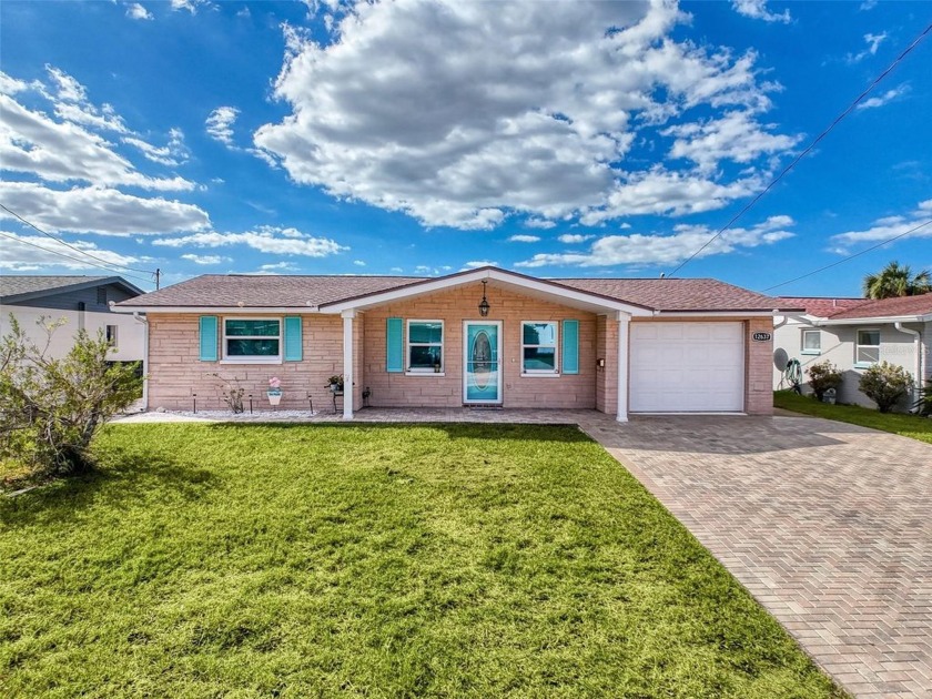 This 2 Bedroom, 2-bathroom (one in the garage) waterfront beauty - Beach Home for sale in Hudson, Florida on Beachhouse.com