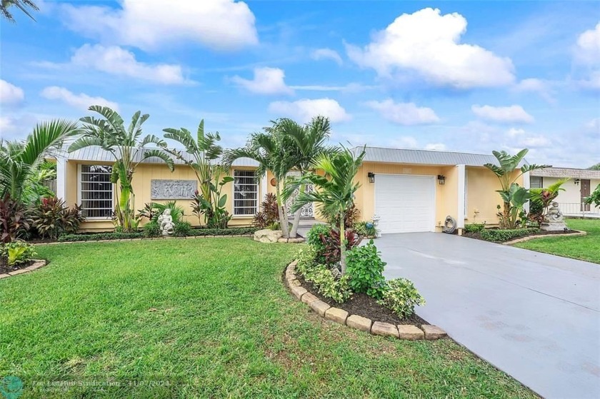 Step into this completely remodeled home and be greeted by - Beach Home for sale in Tamarac, Florida on Beachhouse.com