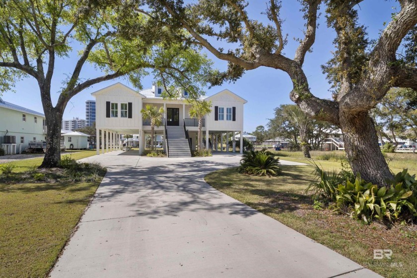 Step into your dream luxury home over looking Johnson Cove and - Beach Home for sale in Orange Beach, Alabama on Beachhouse.com