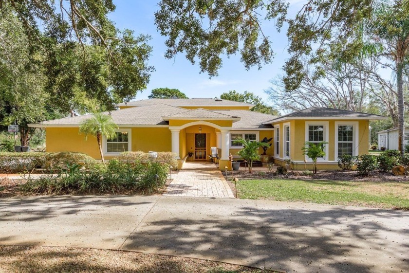 Discover your PRIVATE RETREAT on 1.69 ACRES, offering the - Beach Home for sale in New Port Richey, Florida on Beachhouse.com