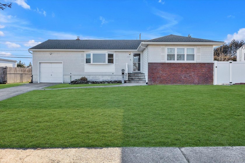 Welcome to this beautifully maintained 3-bedroom ranch offering - Beach Home for sale in Lindenhurst, New York on Beachhouse.com