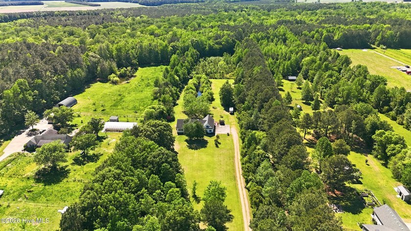 Tucked away in the heart of Camden County, this warm and - Beach Home for sale in Camden, North Carolina on Beachhouse.com