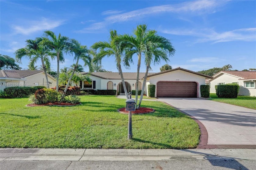 Enjoy serene water views from your fenced in backyard oasis with - Beach Home for sale in Coral Springs, Florida on Beachhouse.com