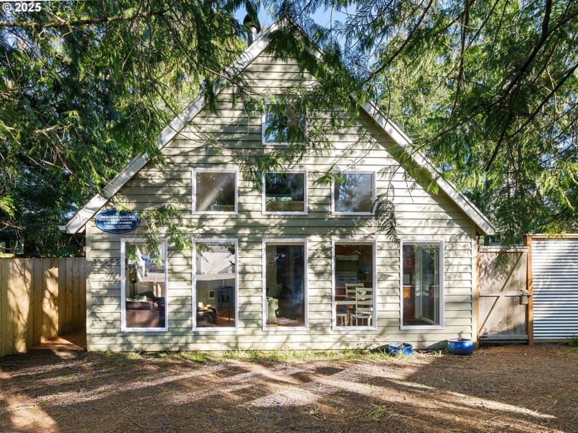 Nestled among the trees in beautiful Nehalem and just minutes - Beach Home for sale in Nehalem, Oregon on Beachhouse.com