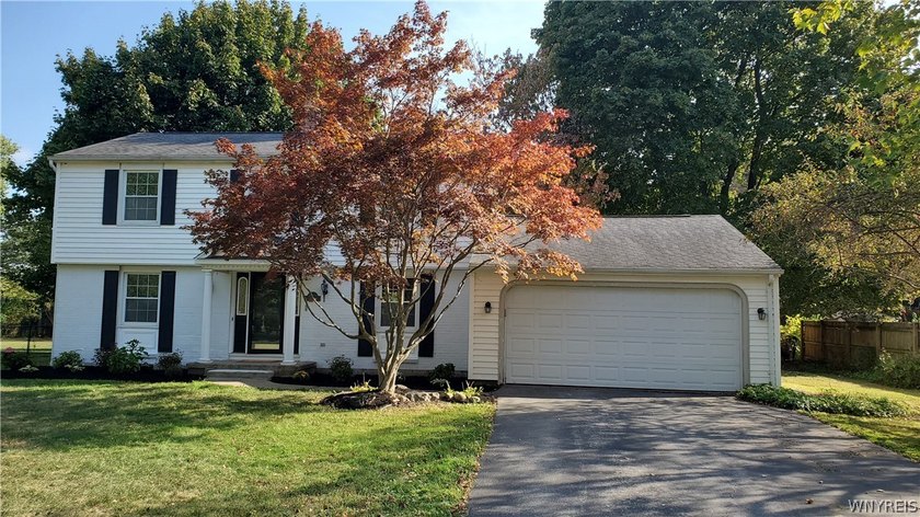 Beautifully refreshed two-story Colonial nestled in one of - Beach Home for sale in Clarence, New York on Beachhouse.com
