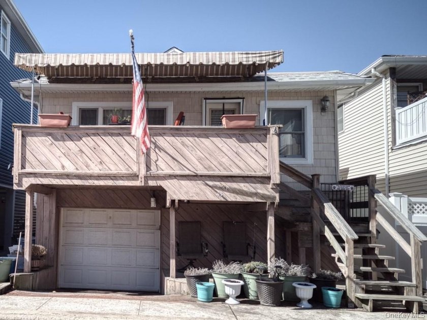 An outdoor deck greets you when you enter this 1 family home! A - Beach Home for sale in Long Beach, New York on Beachhouse.com