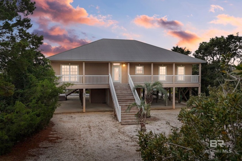 Island Life AWAITS! Through the gate and over the bridge, this - Beach Home for sale in Orange Beach, Alabama on Beachhouse.com