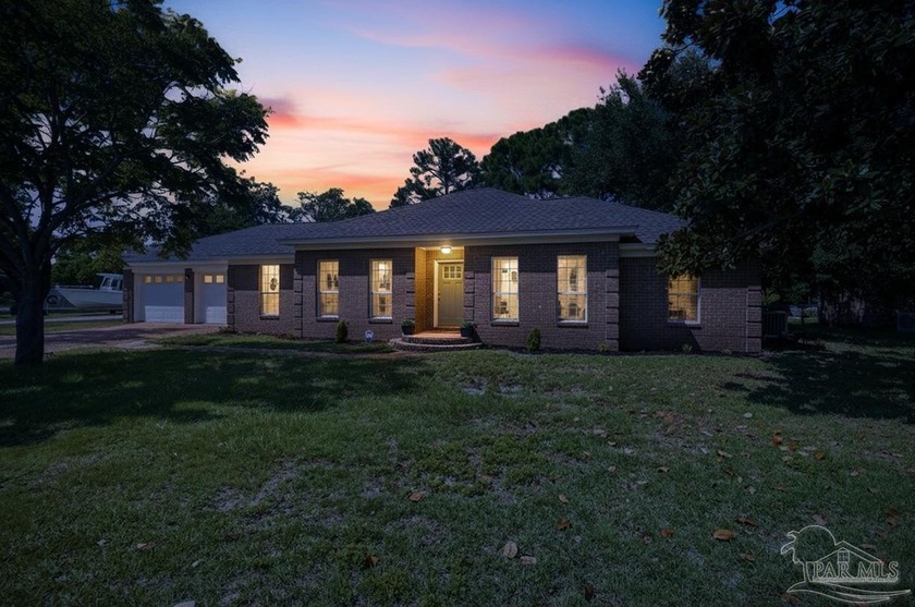 This beautifully updated all-brick corner-lot home is in the - Beach Home for sale in Gulf Breeze, Florida on Beachhouse.com