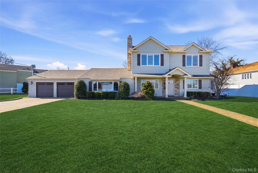 Set on an impressive third of an acre in Nassau Shores and - Beach Home for sale in Massapequa, New York on Beachhouse.com