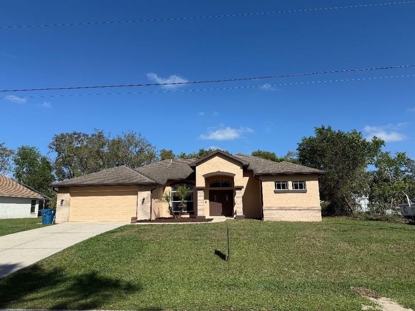 This three-bedroom, two-bathroom, two-car garage, and screened - Beach Home for sale in Spring Hill, Florida on Beachhouse.com