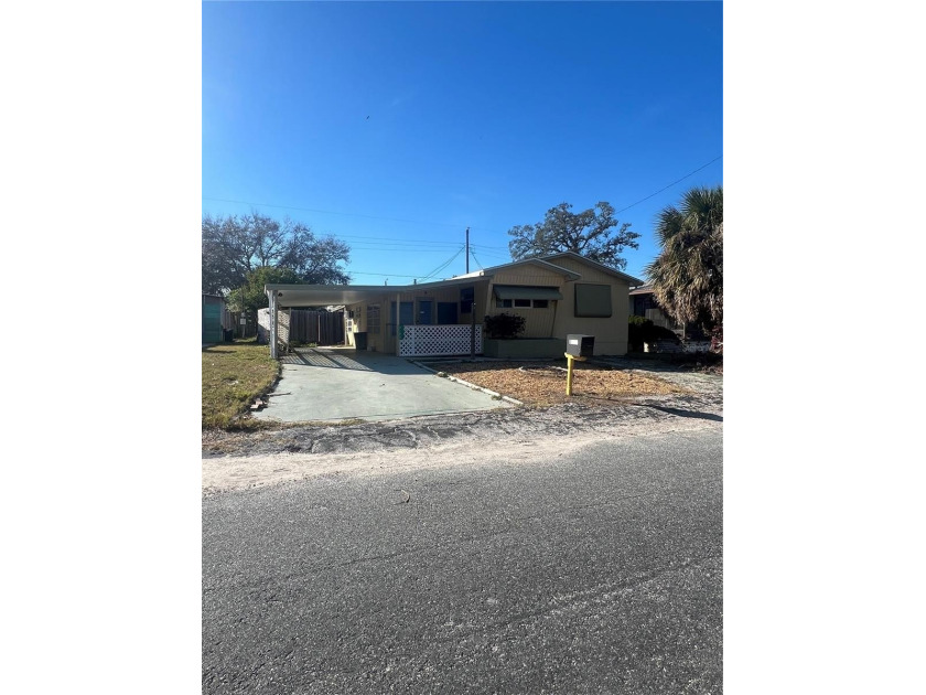 Welcome to this two bedroom, one bath mobile home with potential - Beach Home for sale in Holiday, Florida on Beachhouse.com