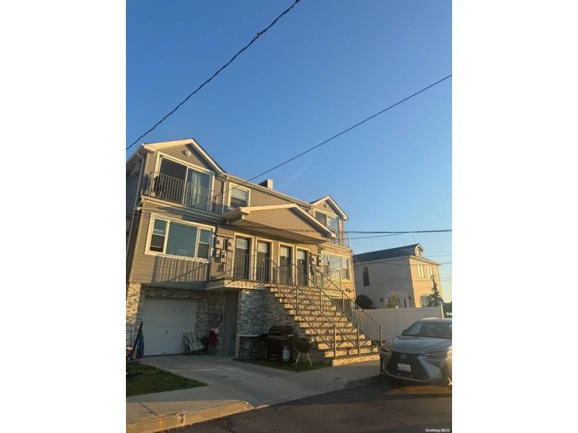 This newly renovated two-family frame home in Arverne, Queens - Beach Townhome/Townhouse for sale in New York, New York on Beachhouse.com