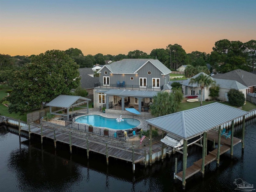 Experience unparalleled waterfront luxury in this breathtaking - Beach Home for sale in Gulf Breeze, Florida on Beachhouse.com