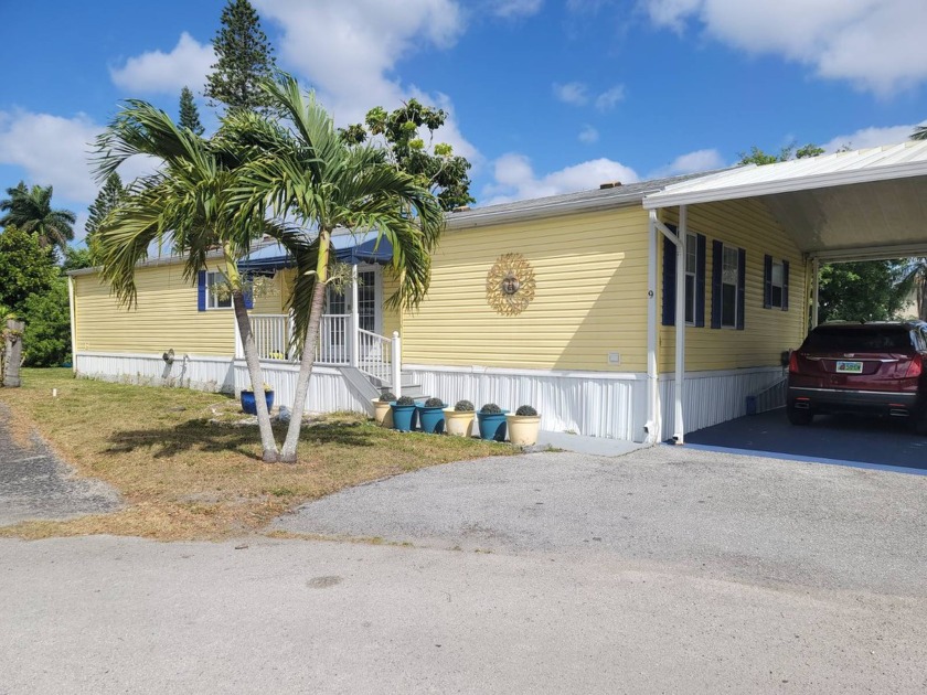 COME SEE this Large 3/2 Home with a 4 Car carport.  Sit on your - Beach Home for sale in Davie, Florida on Beachhouse.com