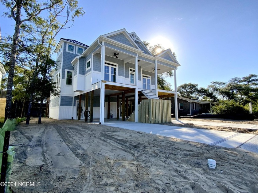 Welcome home! This rare find 5 bedroom NEW tri level home is in - Beach Home for sale in Oak Island, North Carolina on Beachhouse.com