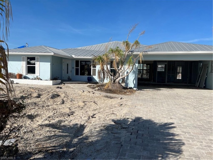 Property has been damaged by hurricane Ian and is being sold as - Beach Home for sale in Fort Myers Beach, Florida on Beachhouse.com