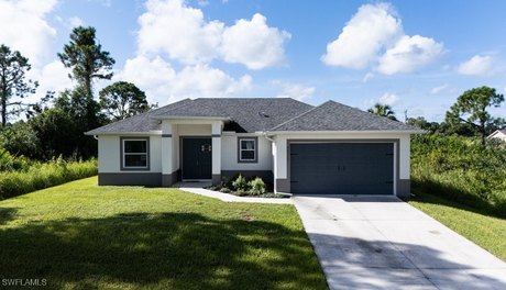 Step into this Lovely 3 Bedroom, 2 Bath Home In Lehigh Acres - Beach Home for sale in Lehigh Acres, Florida on Beachhouse.com