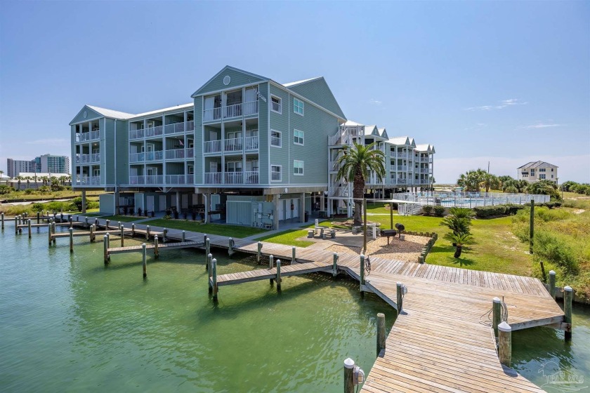 Waterfront Living at its finest! This pristine condo is situated - Beach Condo for sale in Orange Beach, Alabama on Beachhouse.com