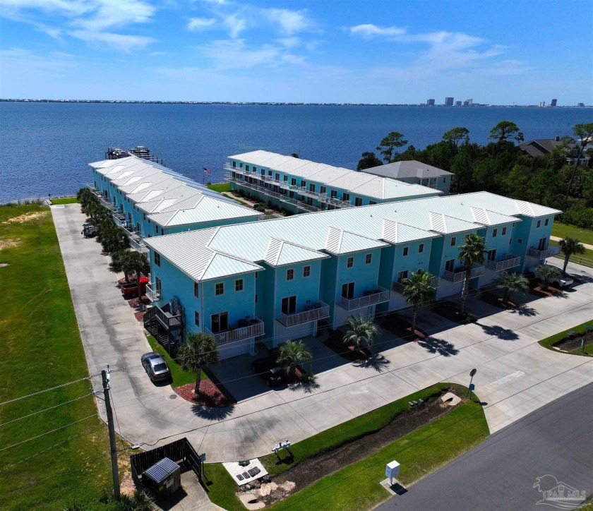 Experience the pinnacle of waterfront living in this - Beach Home for sale in Gulf Breeze, Florida on Beachhouse.com