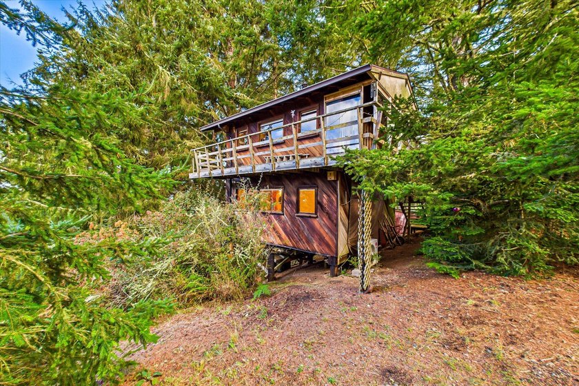 Tucked away on 1.71 acres of forested hillside, this custom - Beach Home for sale in Fortuna, California on Beachhouse.com