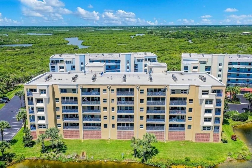 Welcome home to this well-maintained 5th floor condo with - Beach Condo for sale in New Smyrna Beach, Florida on Beachhouse.com