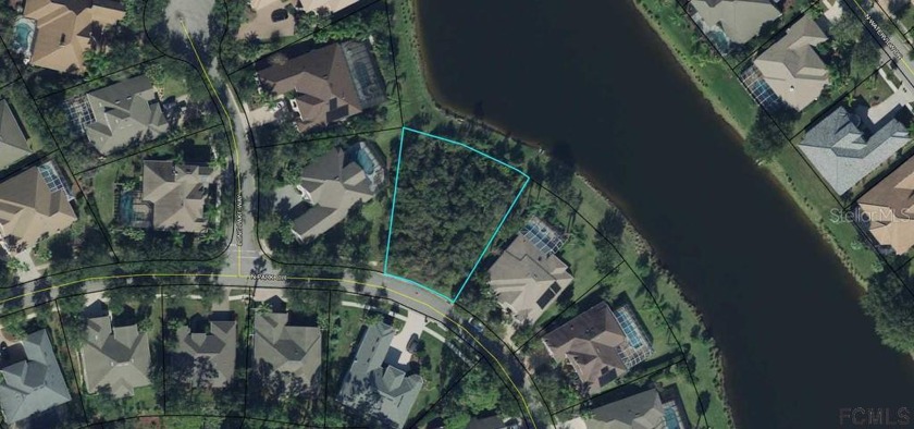 The last oversized 15,159 sq. ft.lakefront lot  in the desirable - Beach Lot for sale in Palm Coast, Florida on Beachhouse.com