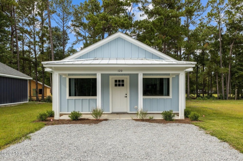 Discover Coastal Elegance at The Cabins at Old Horse a new small - Beach Condo for sale in Stella, North Carolina on Beachhouse.com