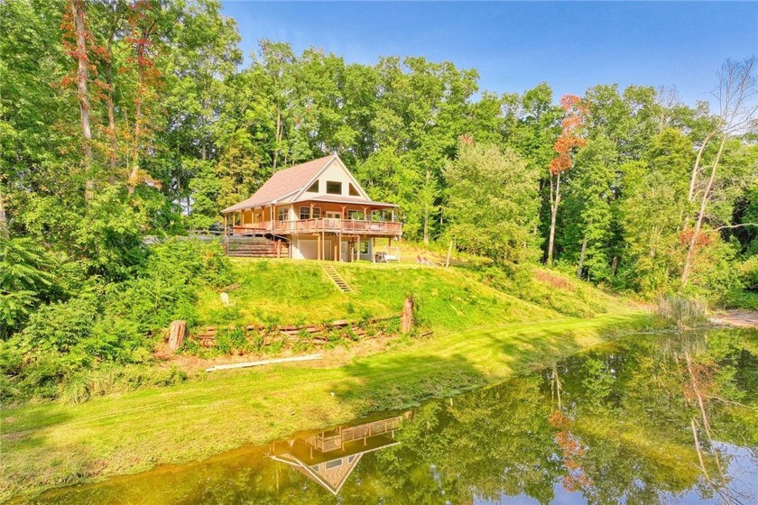 RARE FIND! BREATHTAKING 4.5 ACRE WOODED SETIING FOR THIS AMAZING - Beach Home for sale in Webster, New York on Beachhouse.com